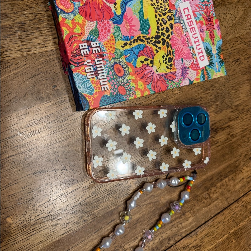 Casetify Clear Daisy iPhone Case with Blue Trim and Gold Accent